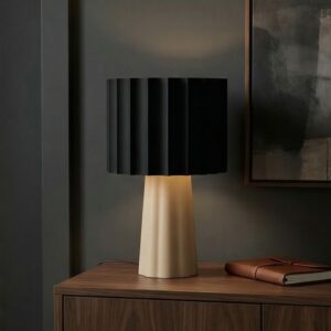 table lamp with black shade on wooden cabinet